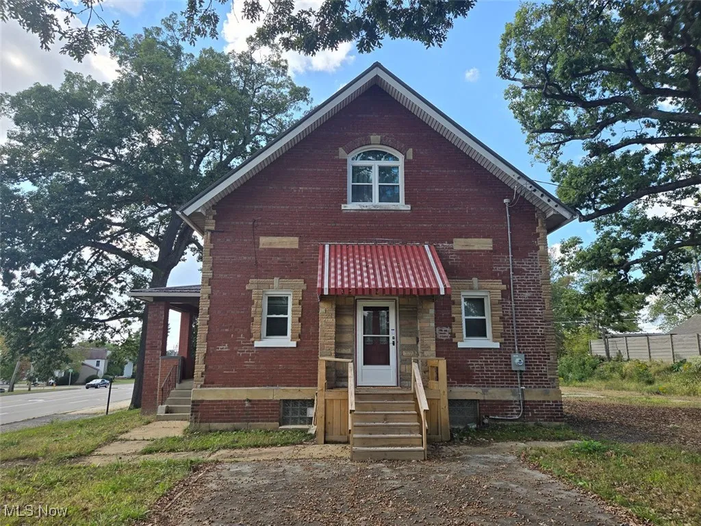 View of front of property with brick siding