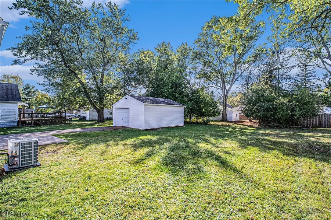 View of yard featuring an outbuilding and a detached garage