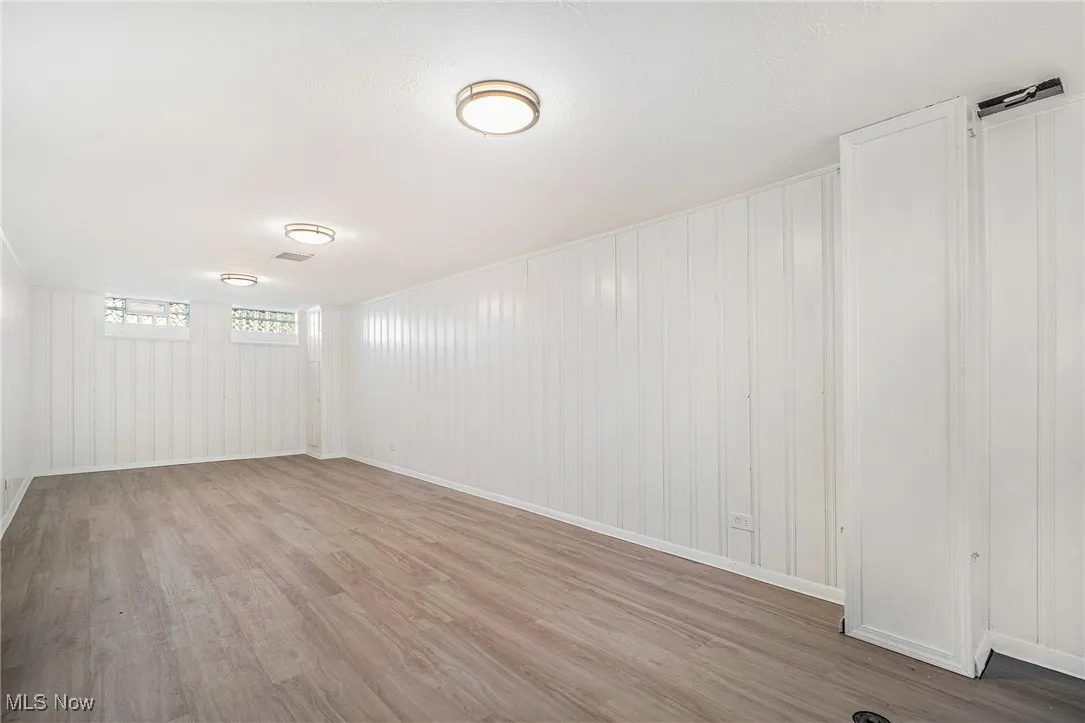 Empty room featuring light wood-type flooring and baseboards