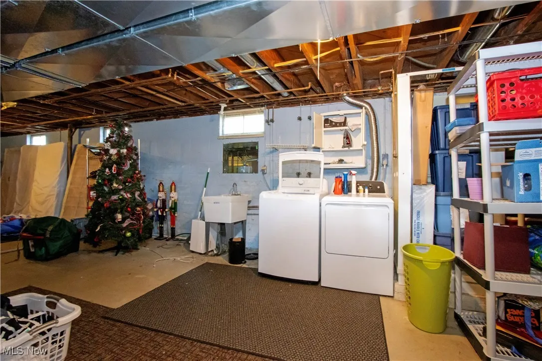 Basement featuring washing machine and dryer