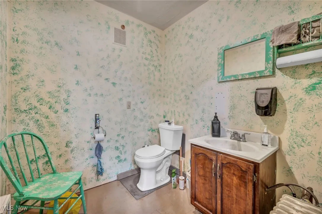 Bathroom on main floor with vanity and toilet