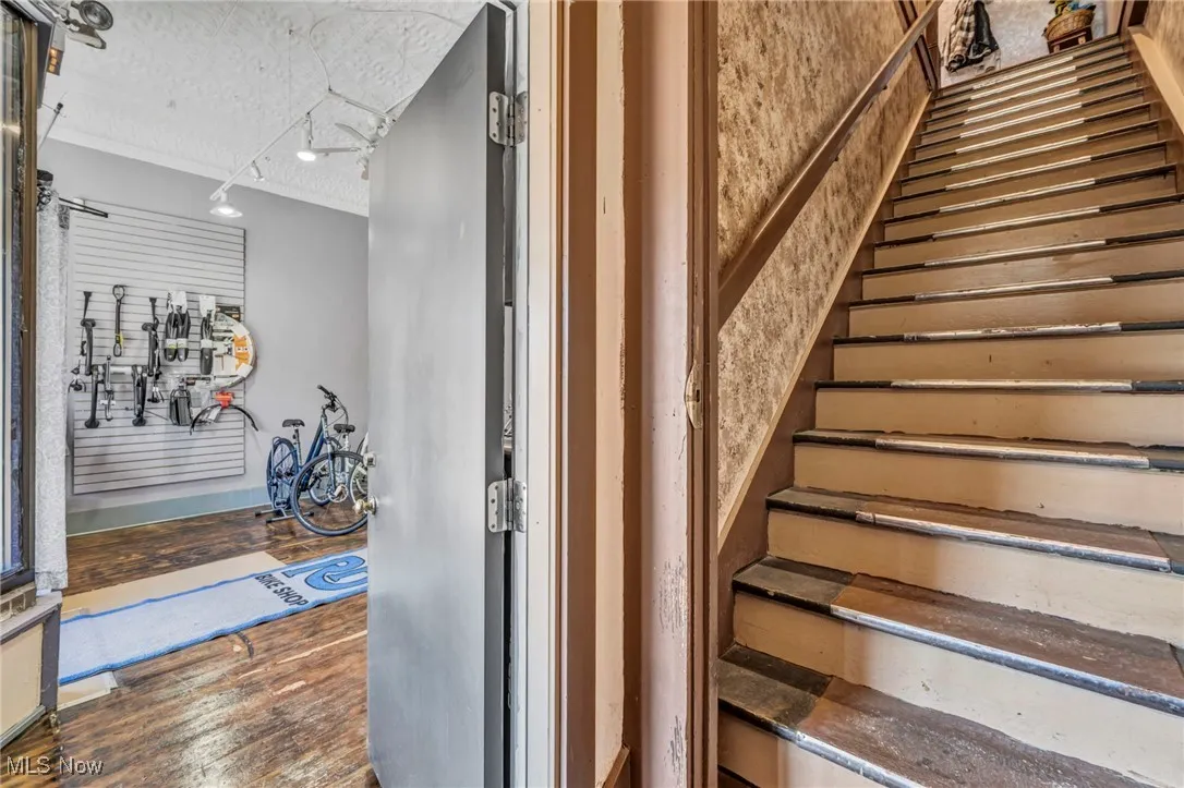 Stairs leading upstairs to residential living or the retail space