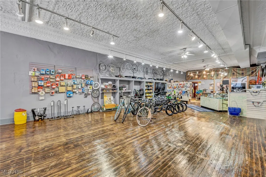 Retail entrance / hardwood floors throughout / wall storage / open layout