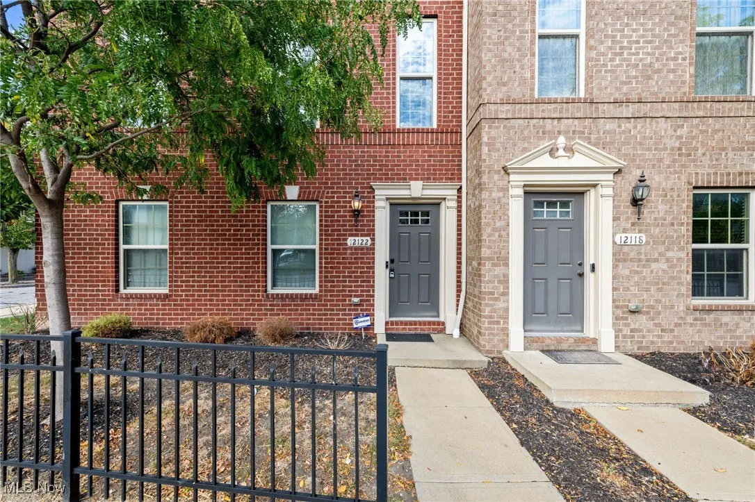 View of exterior entry with brick siding