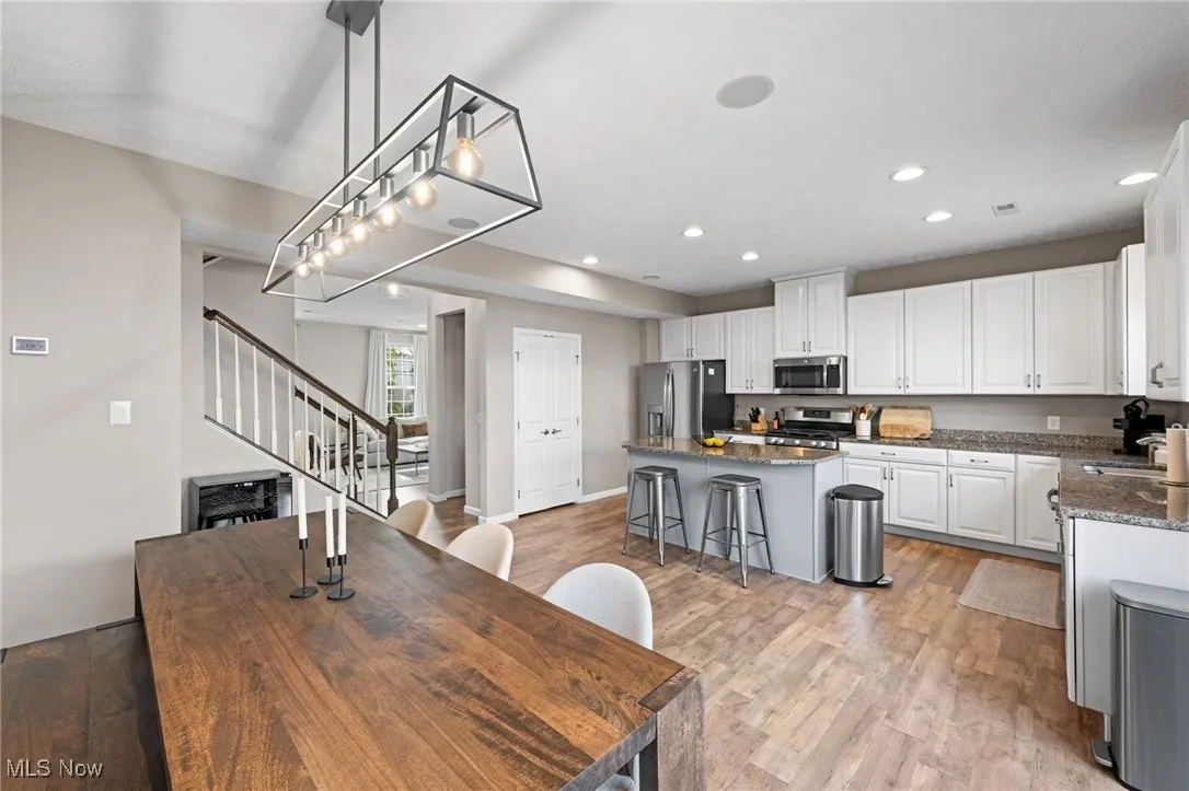 Dining room featuring light wood finished floors, and recessed lighting