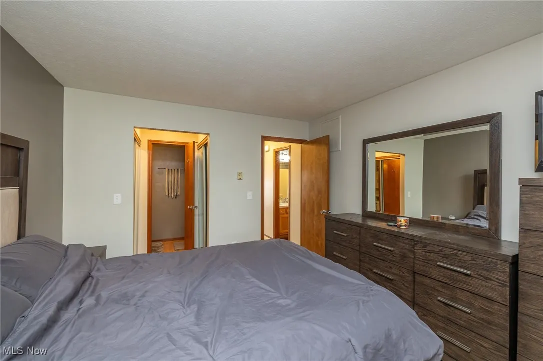 Bedroom with a textured ceiling