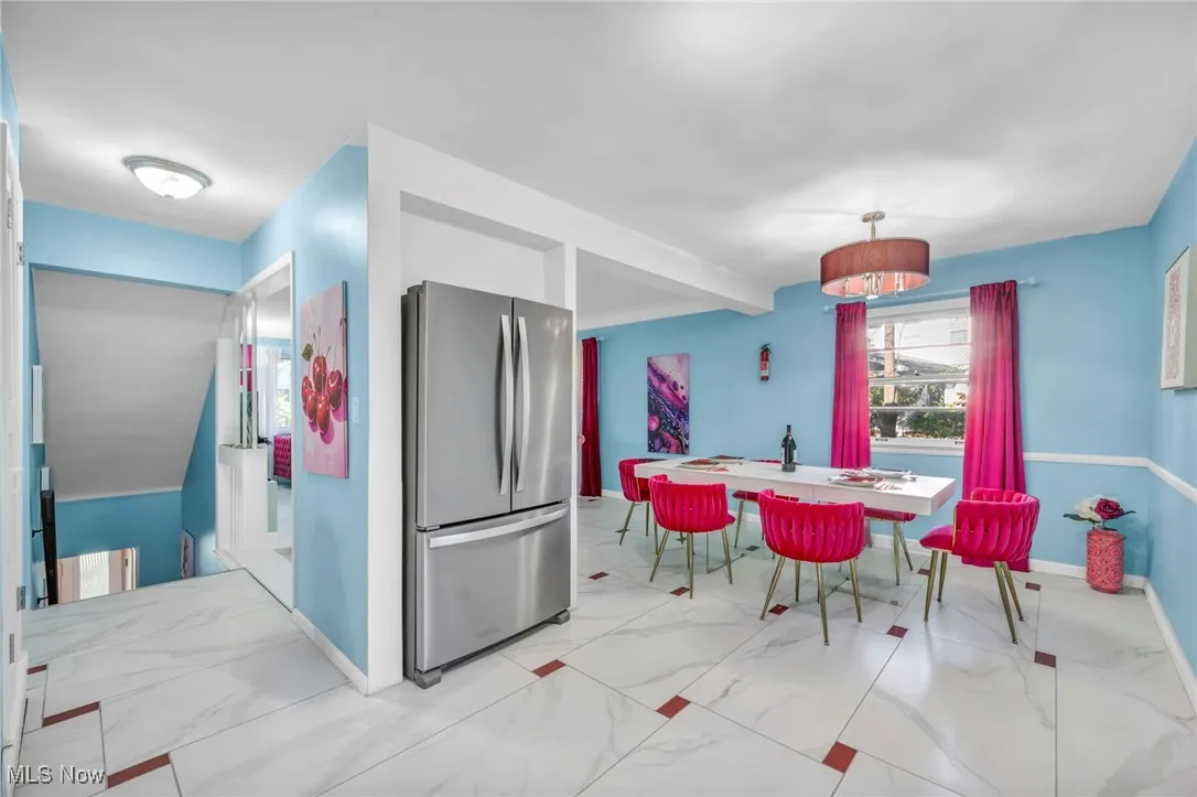 Kitchen featuring freestanding refrigerator