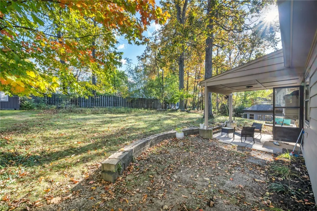 Fenced backyard with a patio area and an outdoor living space