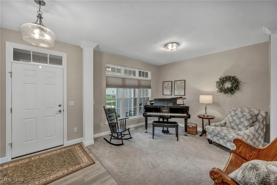Entrance foyer with wood finished floors and baseboards