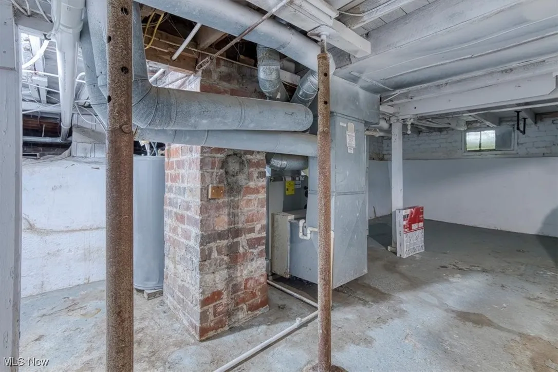 Below grade area with water heater and heating unit