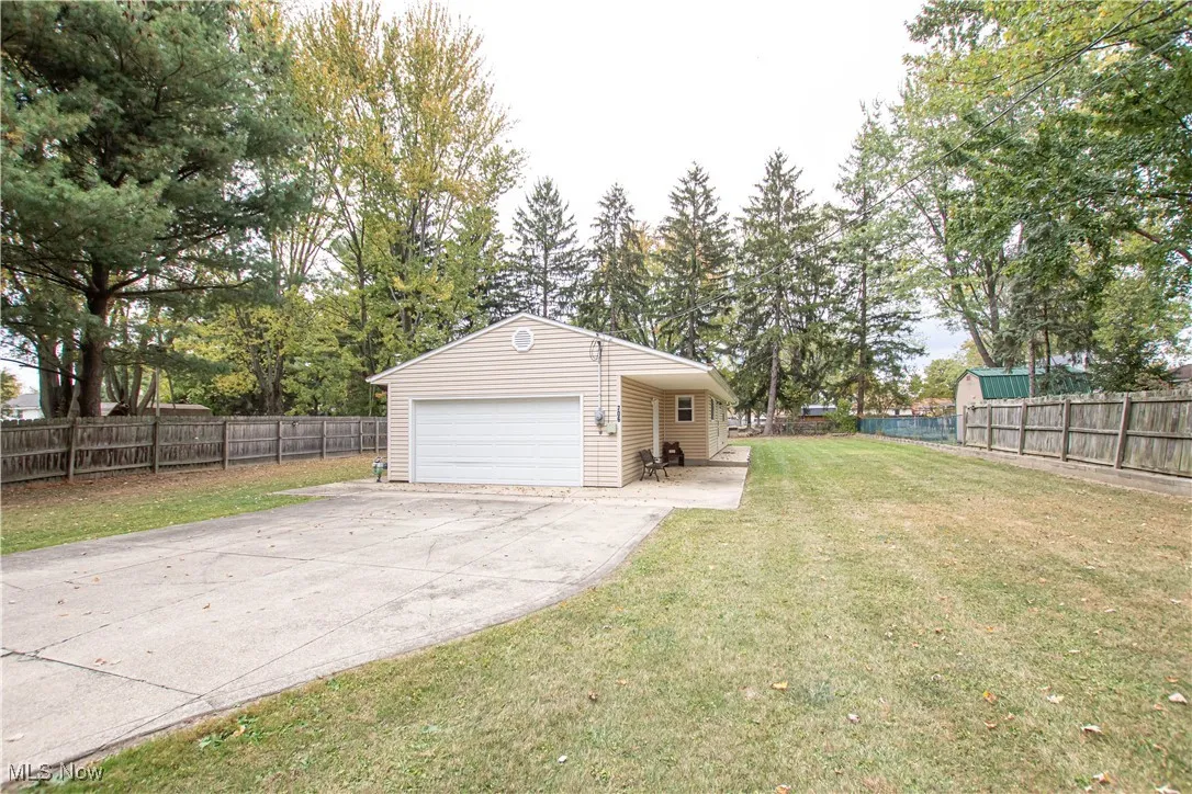 Garage with concrete driveway