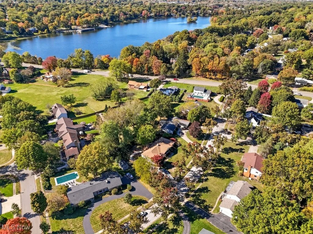 Aerial overview of property's location featuring a large body of water and nearby suburban area