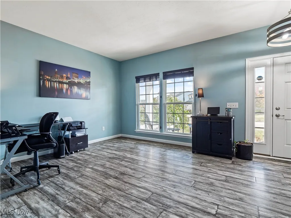 Office with wood finished floors