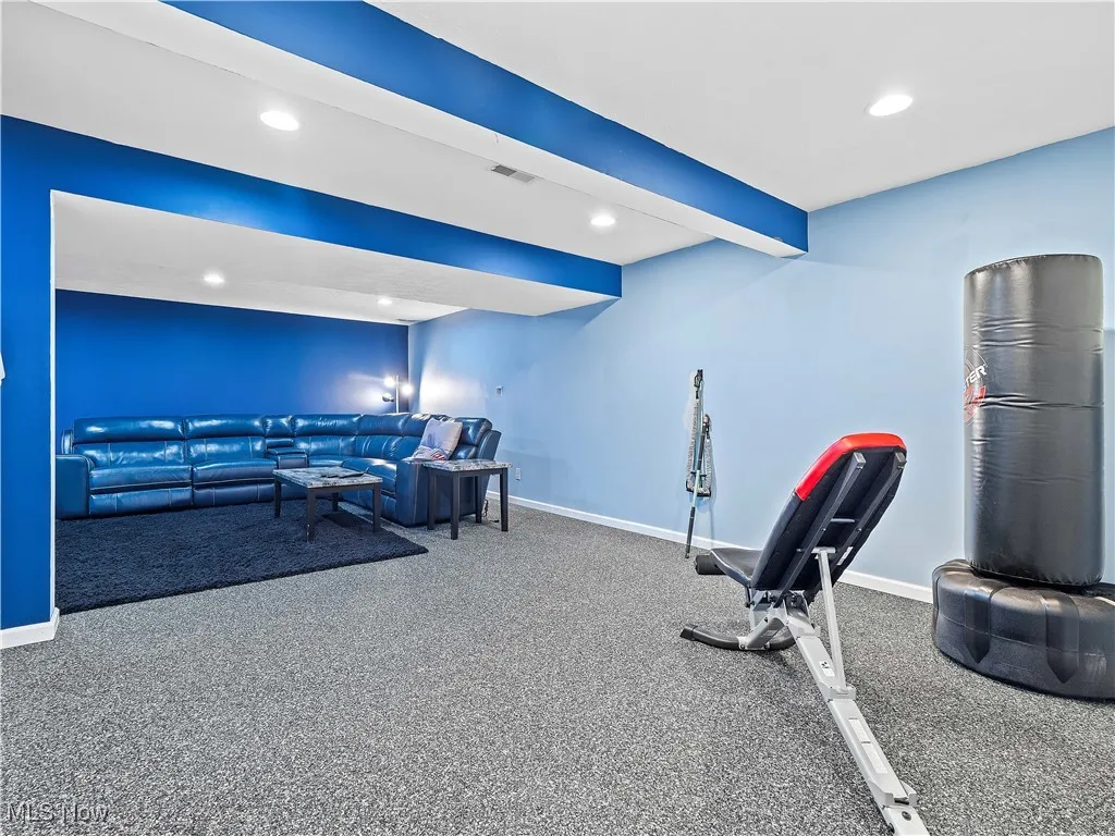 Workout area with recessed lighting and carpet flooring