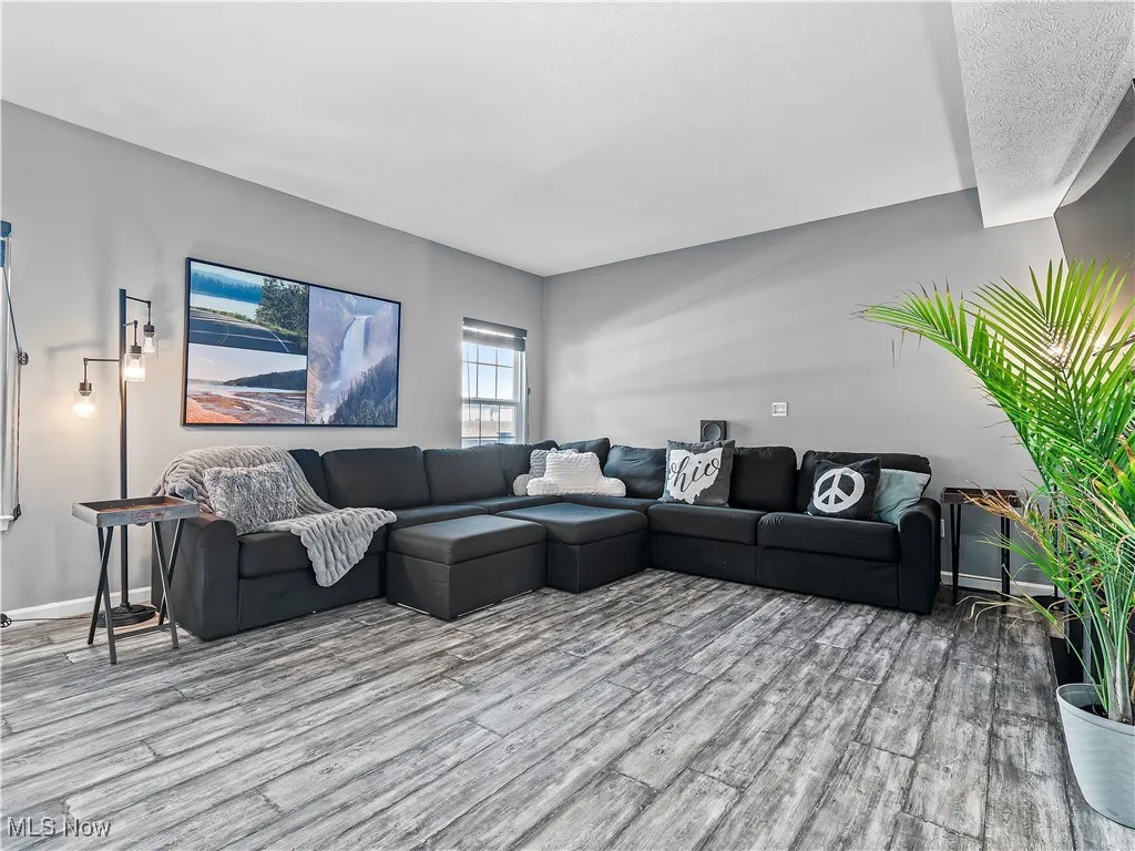 Living room with wood finished floors and baseboards