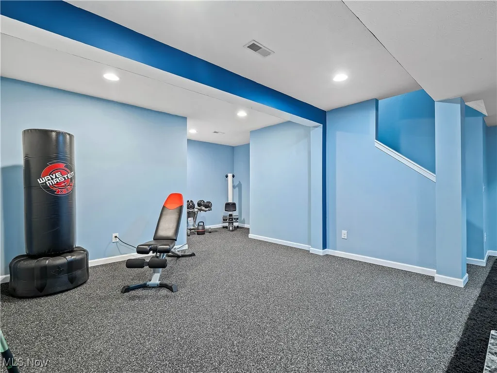Exercise area with recessed lighting and carpet floors