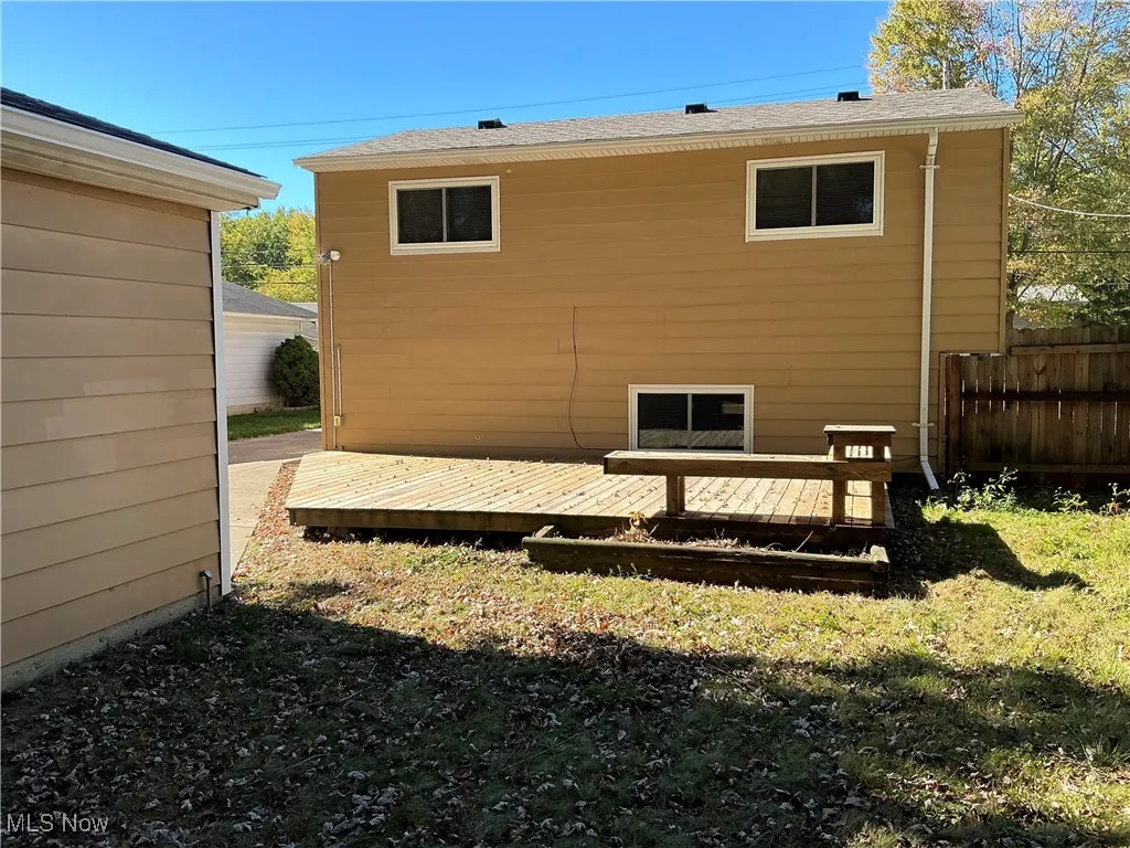 View of side of home with a deck