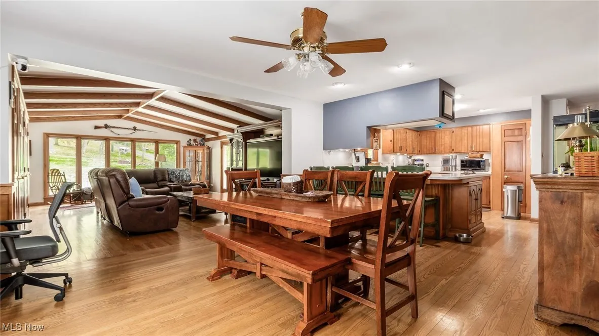 Dining area featuring light wood-type flooring and ceiling fan