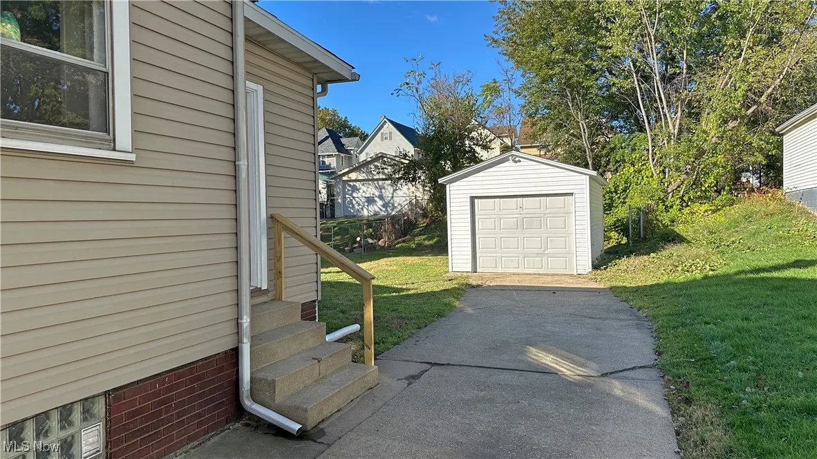 One car garage and a long driveway