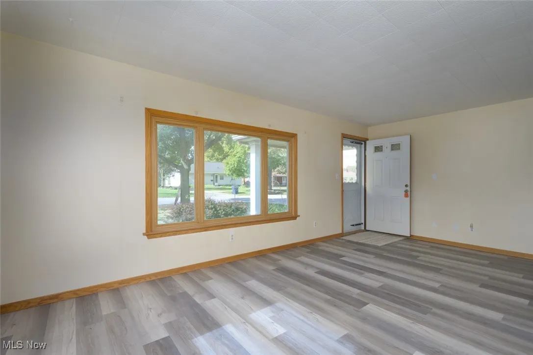 Unfurnished room with light wood-style floors
