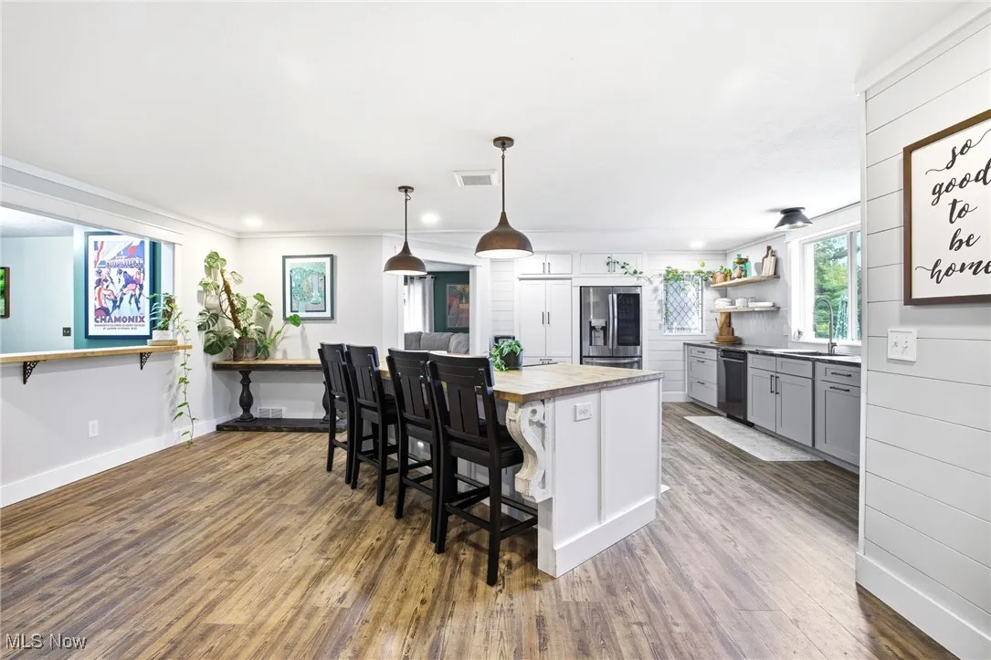 Kitchen featuring the island, cabinetry and appliances