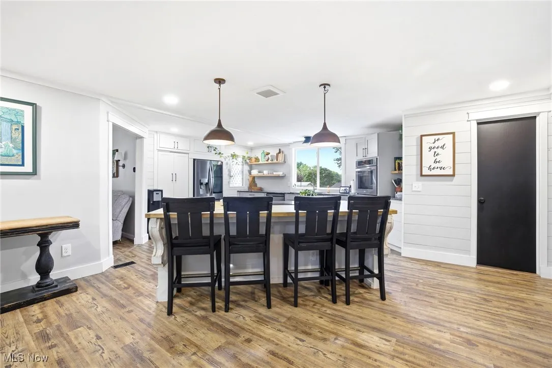 Kitchen featuring an island with seating