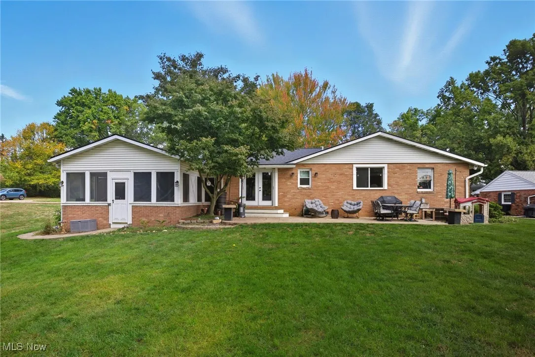 Rear view of home featuring the patio area
