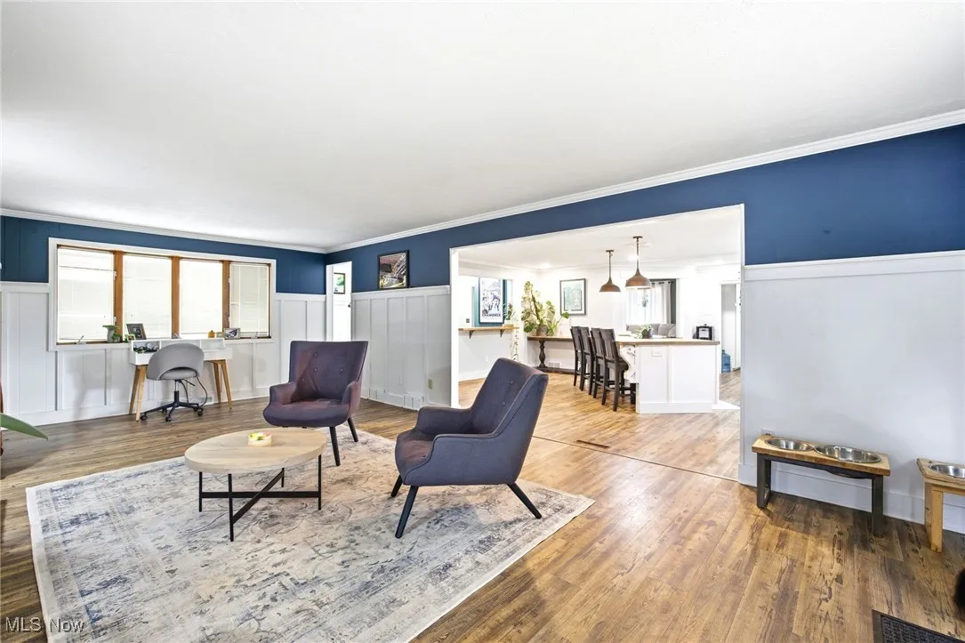 Family room area featuring LVT flooring adjoining the kitchen