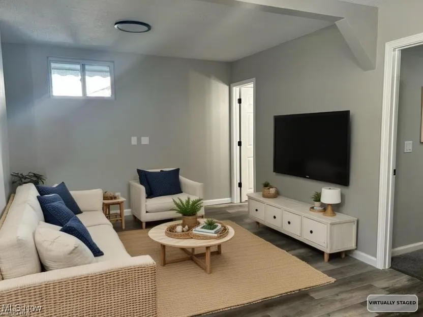 Living area with dark wood-type flooring