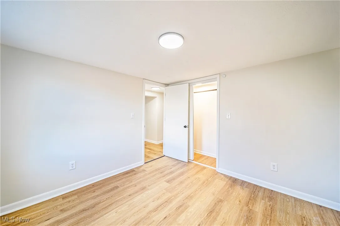 Unfurnished bedroom with light hardwood / wood-style flooring