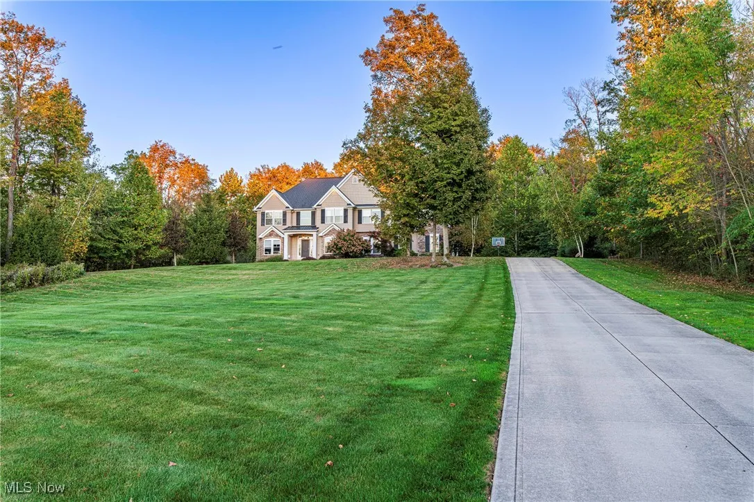 View of the front with a long private driveway
