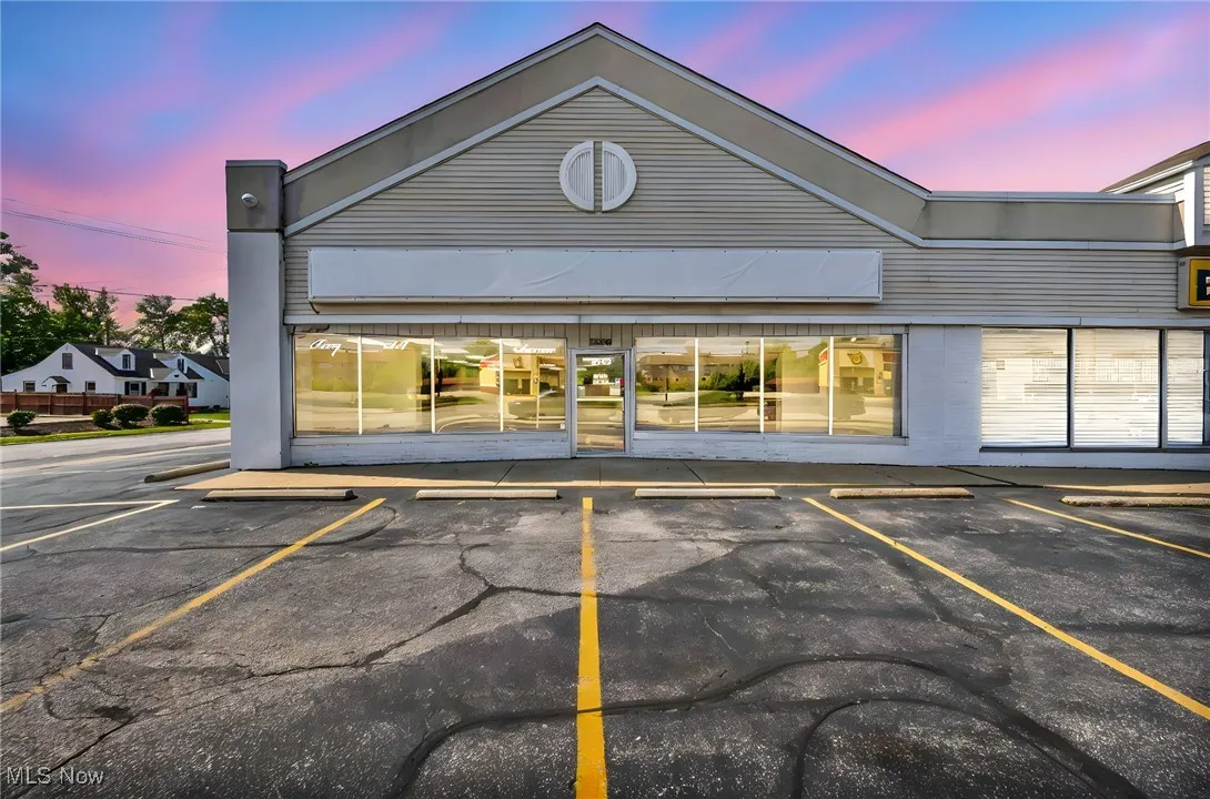 Property at dusk with uncovered parking