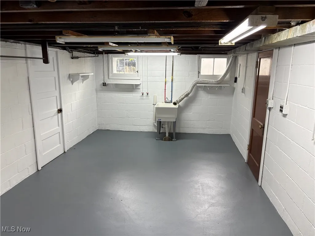 Below grade area featuring a sink