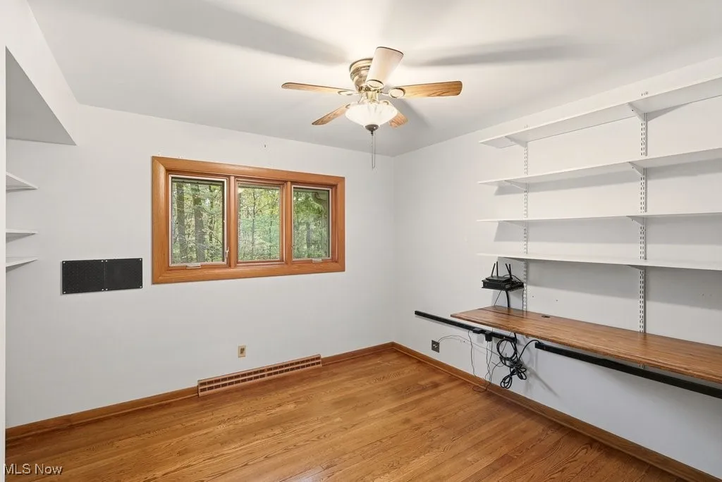 Bedroom 4 with hardwood flooring and built in hinged desk
