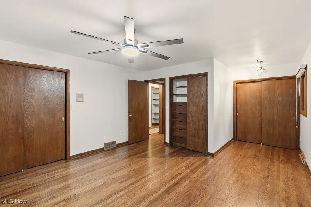Primary bedroom with 3 closets and en-suite full bath