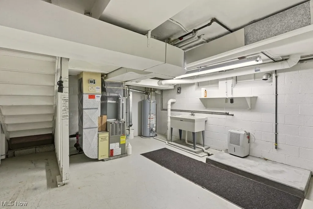 Lower level laundry room and mechanicals with 1 of 2 furnaces