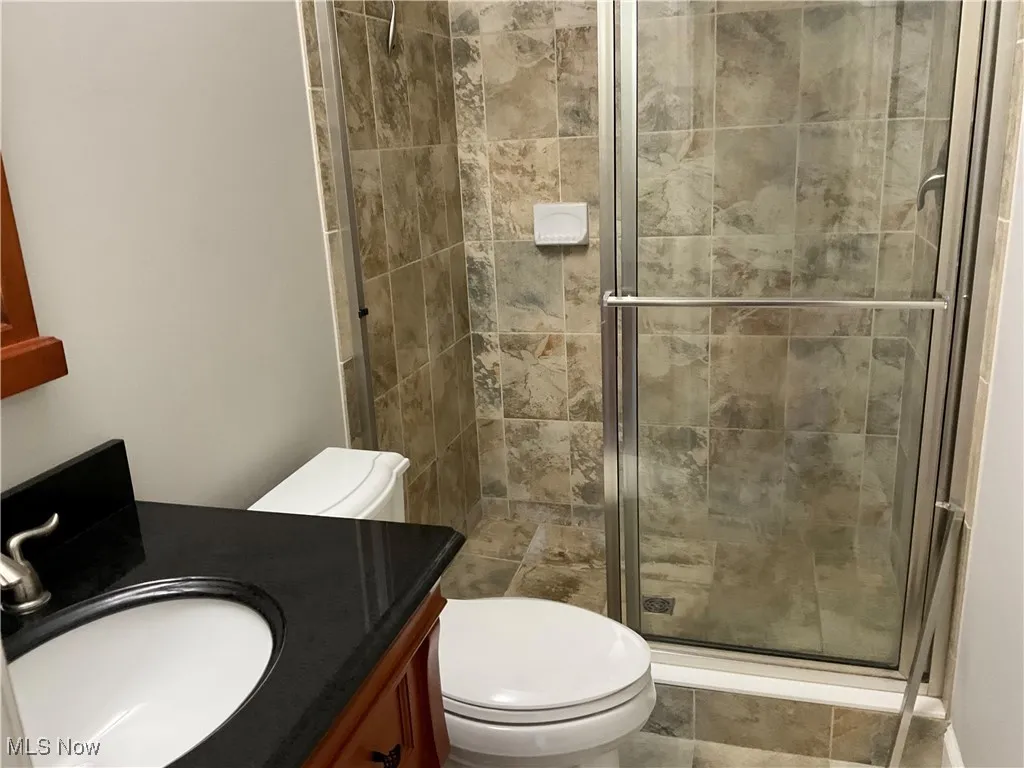 Master Full bathroom featuring a stall shower and vanity