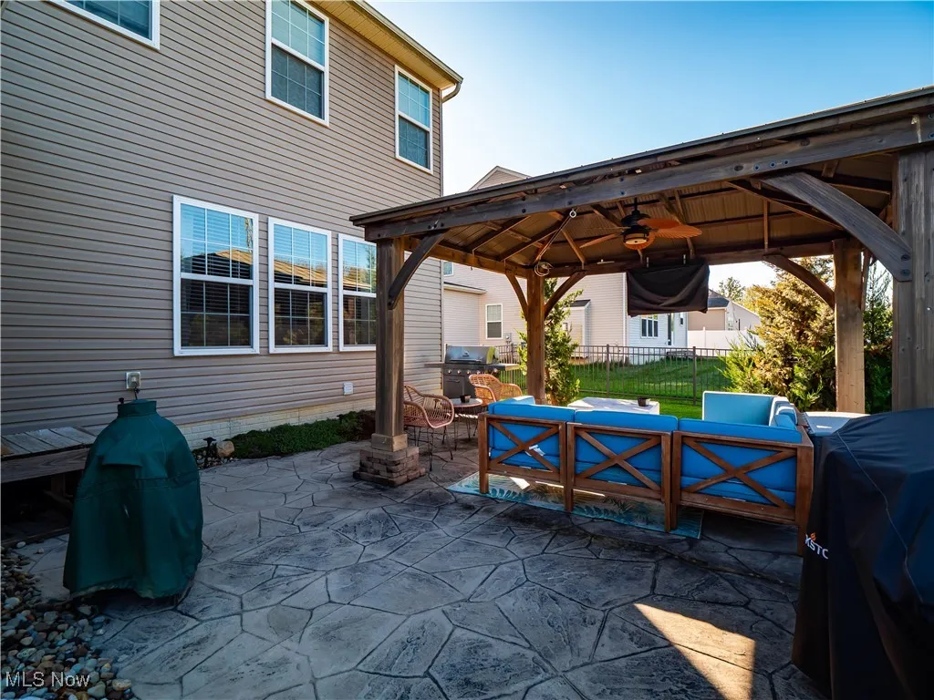 View of patio with an outdoor hangout area, a gazebo, and area for grilling