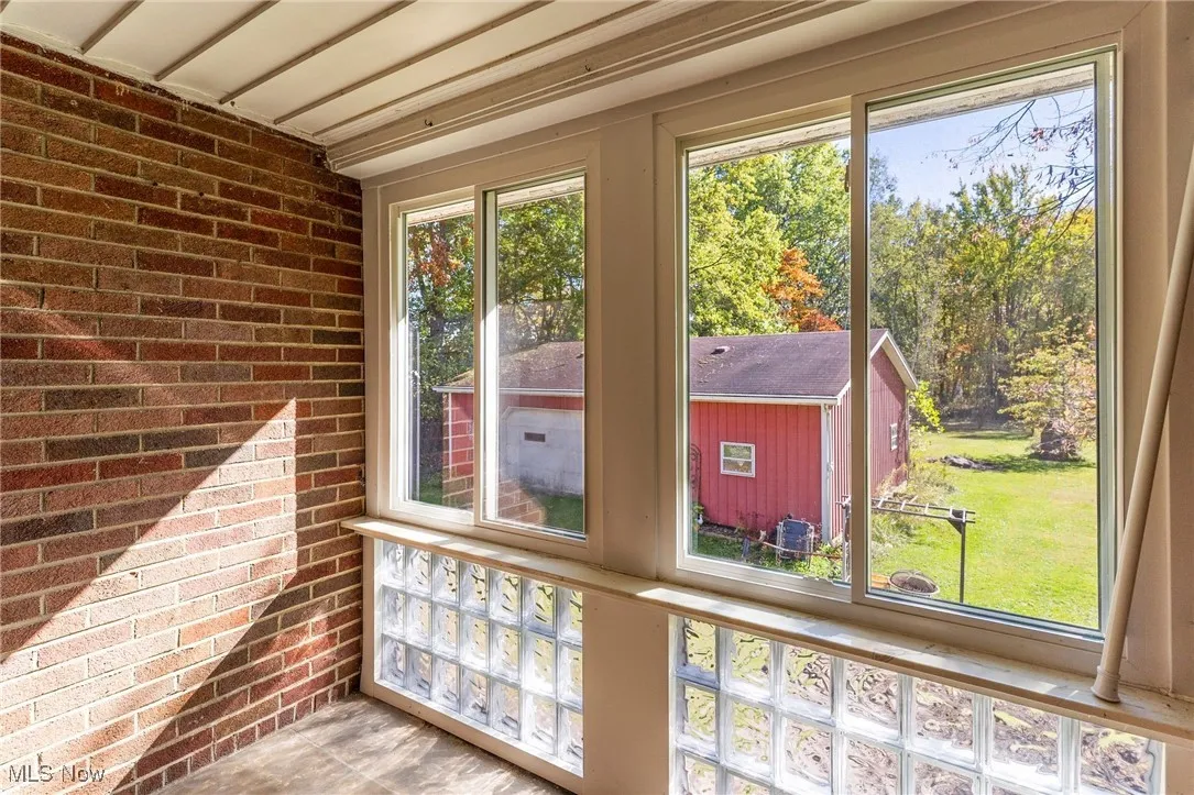 Unfurnished sunroom with plenty of natural light