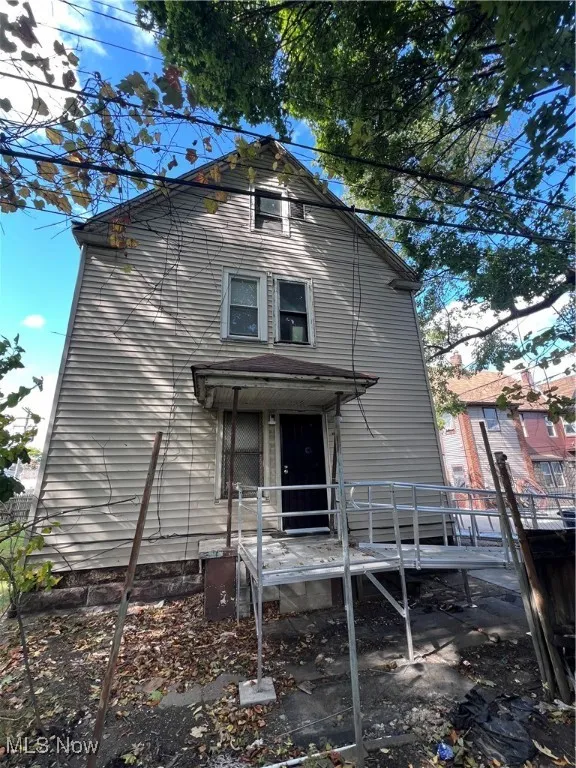 Back of property featuring a deck