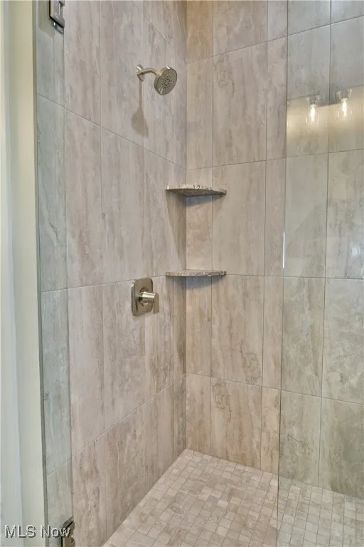Bathroom featuring a shower stall