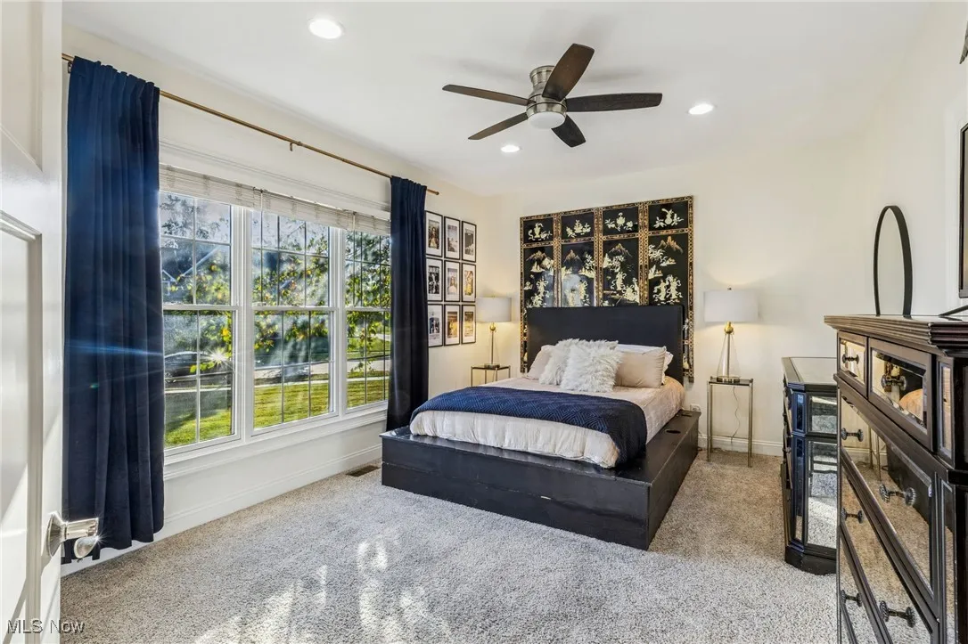 Bedroom with recessed lighting and a ceiling fan