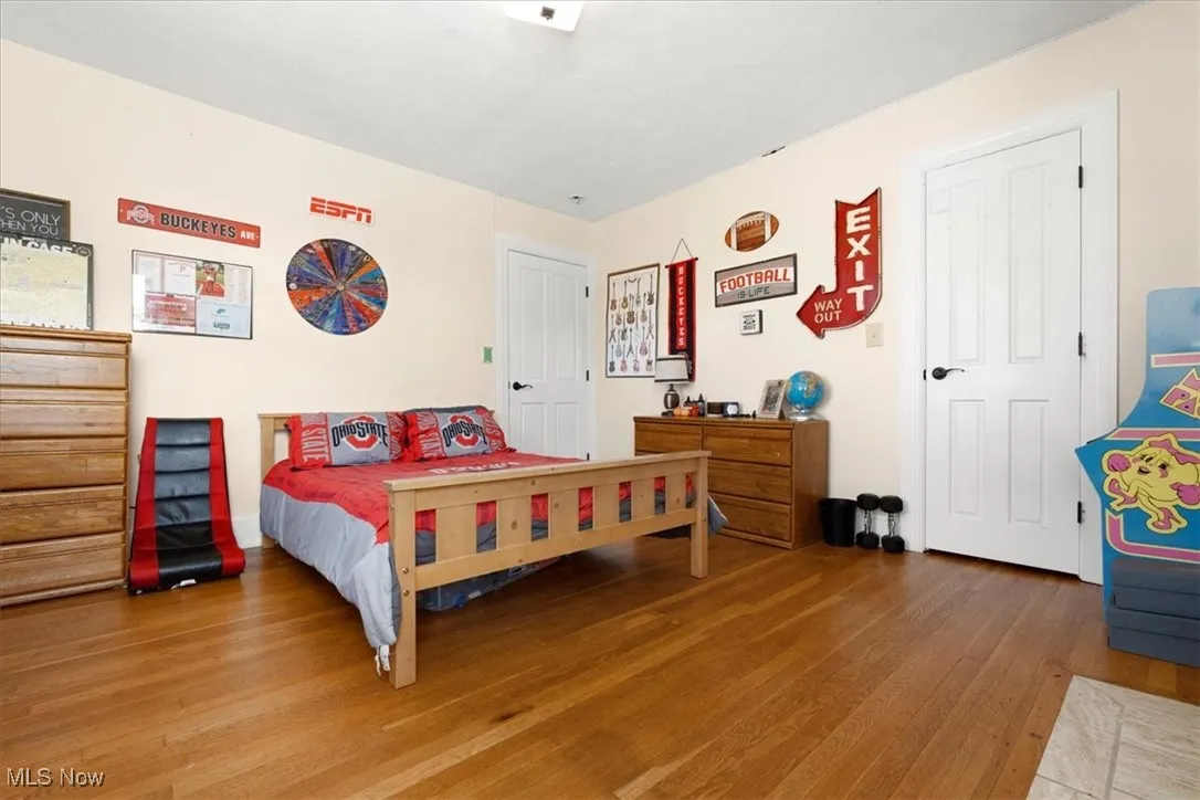 Bedroom with wood finished floors