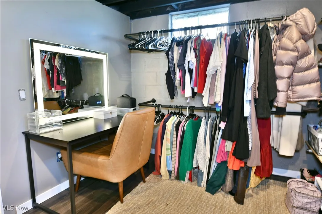 Walk in closet featuring wood finished floors