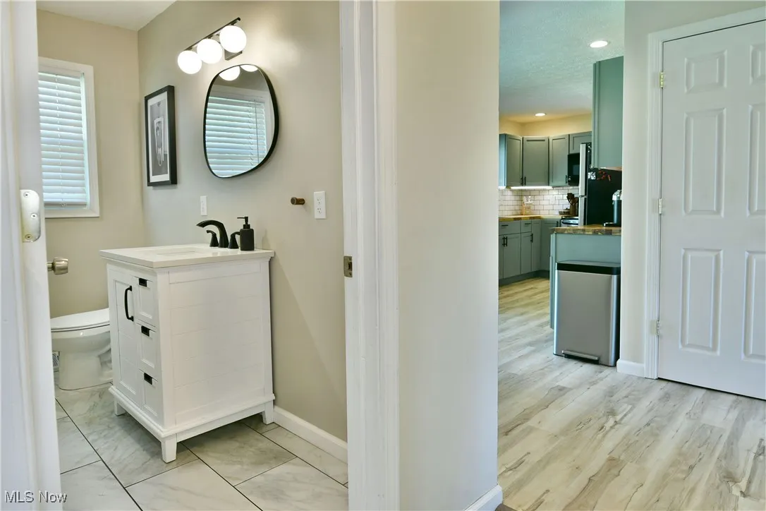 Bathroom with decorative backsplash and vanity