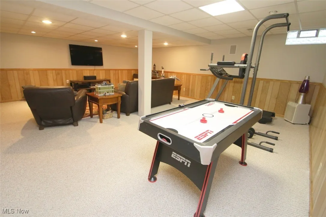 Playroom featuring a drop ceiling, carpet floors, and recessed lighting