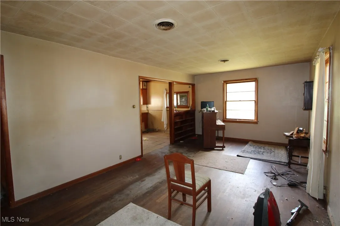 Bedroom featuring wood finished floors and baseboards