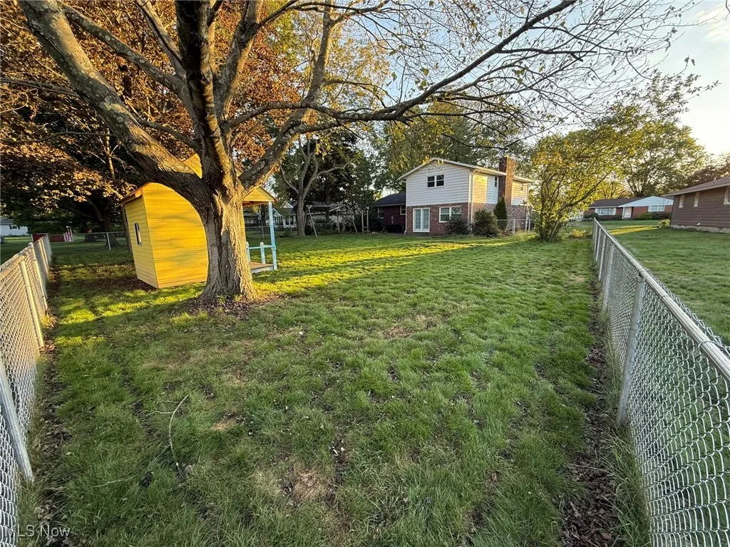 View of fenced backyard