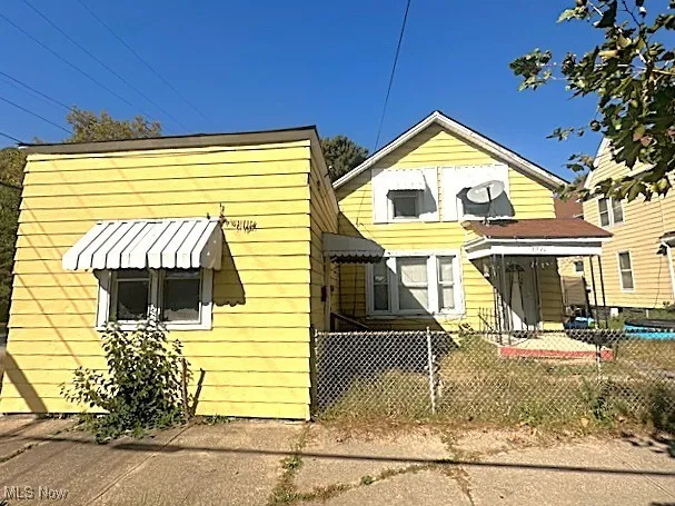 View of front facade with a fenced front yard