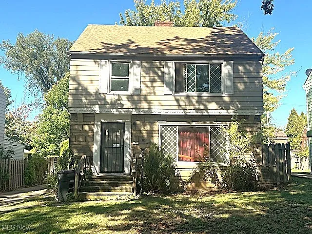 View of front of property with a chimney